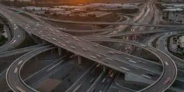 Modern highway interchange with smooth roads and sturdy bridges at sunset
